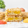 Healthy Peach Crumble Bars with fresh peaches slices