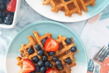 Healthy Oat Waffles topped with fresh berries.