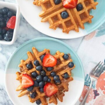 Healthy Oat Waffles topped with fresh berries.