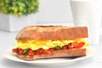 bruschetta and egg sandwich with scrambled eggs