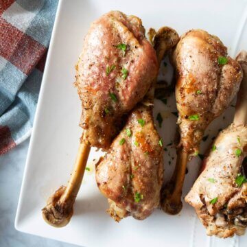 Roasted Turkey Drumsticks on a platter.