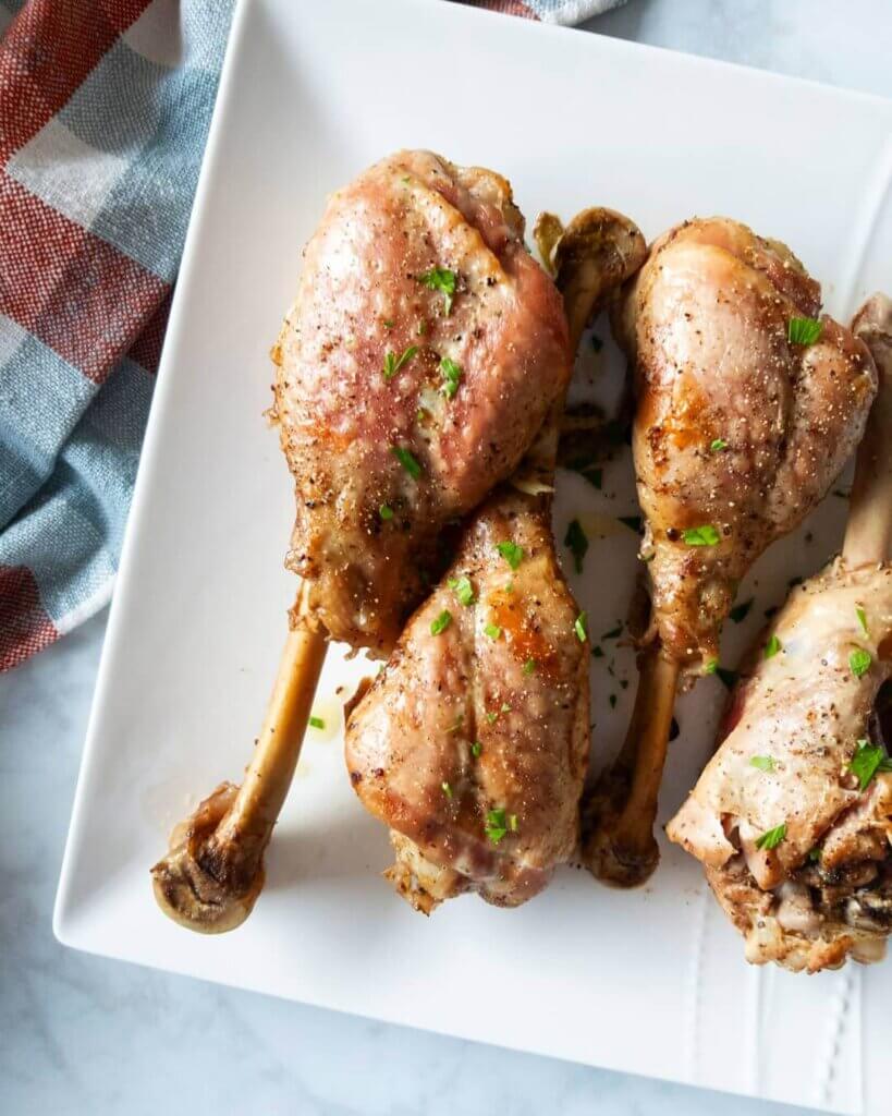 Roasted Turkey Drumsticks on a platter.