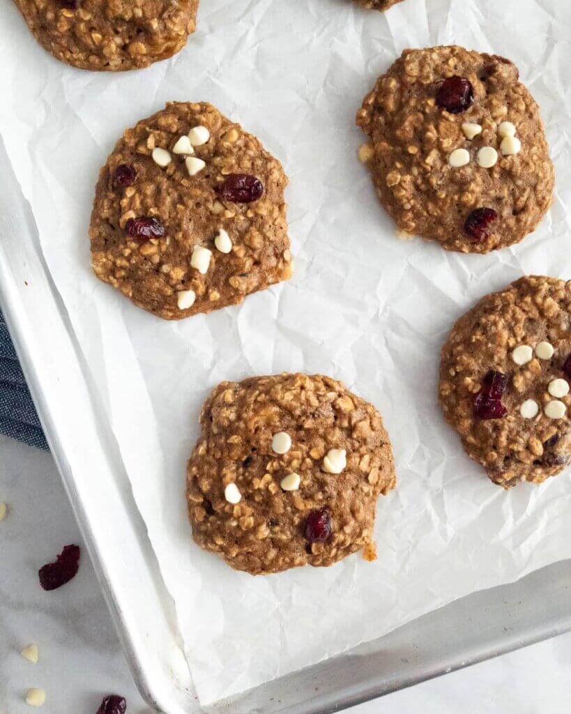 Healthy Cranberry Banana Breakfast Cookies on a baking sheet lined with parchment paper.