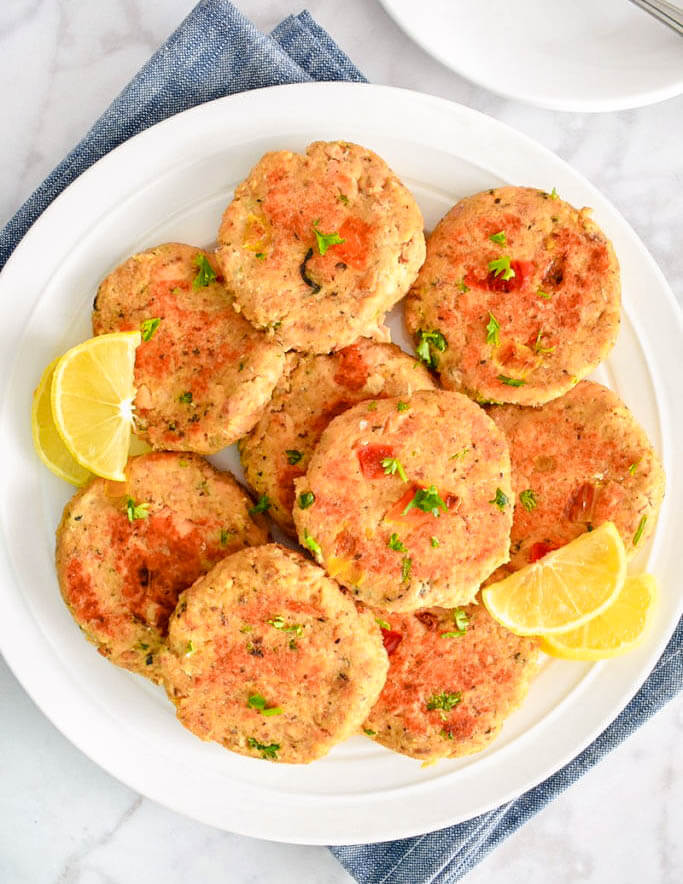 Platter of Salmon Cakes served with lemon wedges.