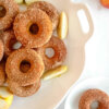 Platter of Baked Apple Donuts with a cinnamon sugar coating.