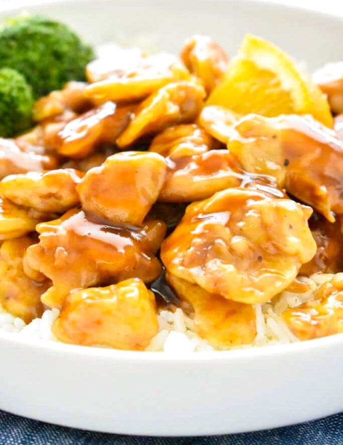 Close up of a plate of saucy Baked Orange Chicken.