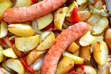 sausage sheet pan dinner with whole italian sausages, potatoes, peppers and onions