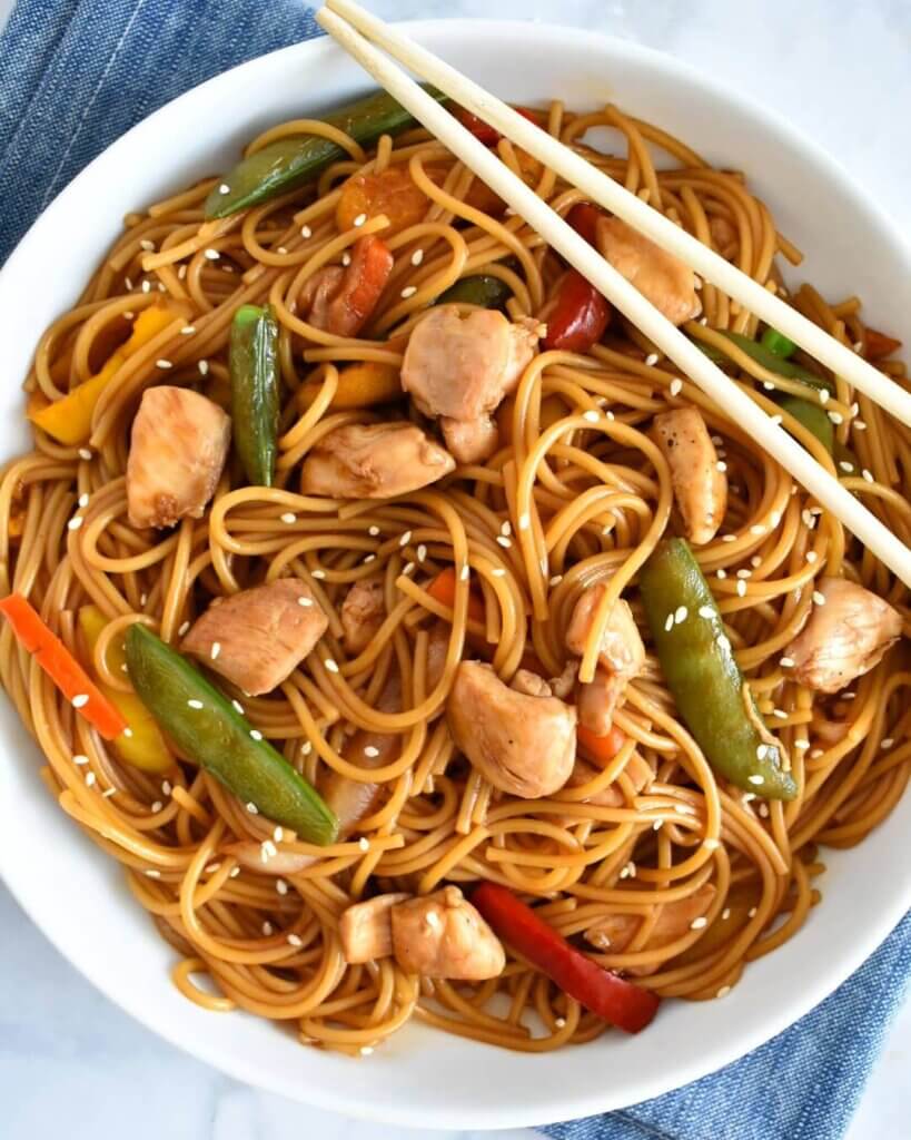 chicken teriyaki stir fry bowl with noodles.