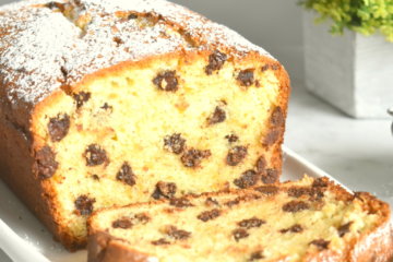 Sliced Chocolate Chip Ricotta Cake on a serving platter.