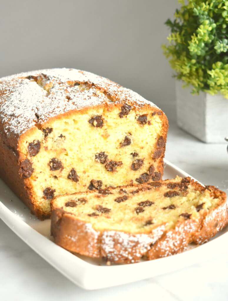 Sliced Chocolate Chip Ricotta Cake on a serving platter.