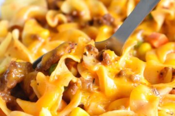 Cheesy beef and noodle casserole closeup.