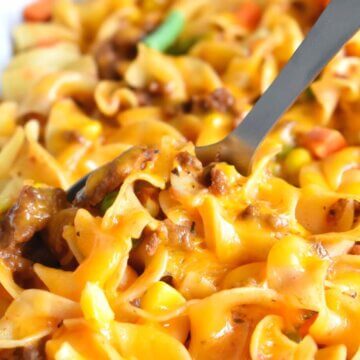 Cheesy beef and noodle casserole closeup.