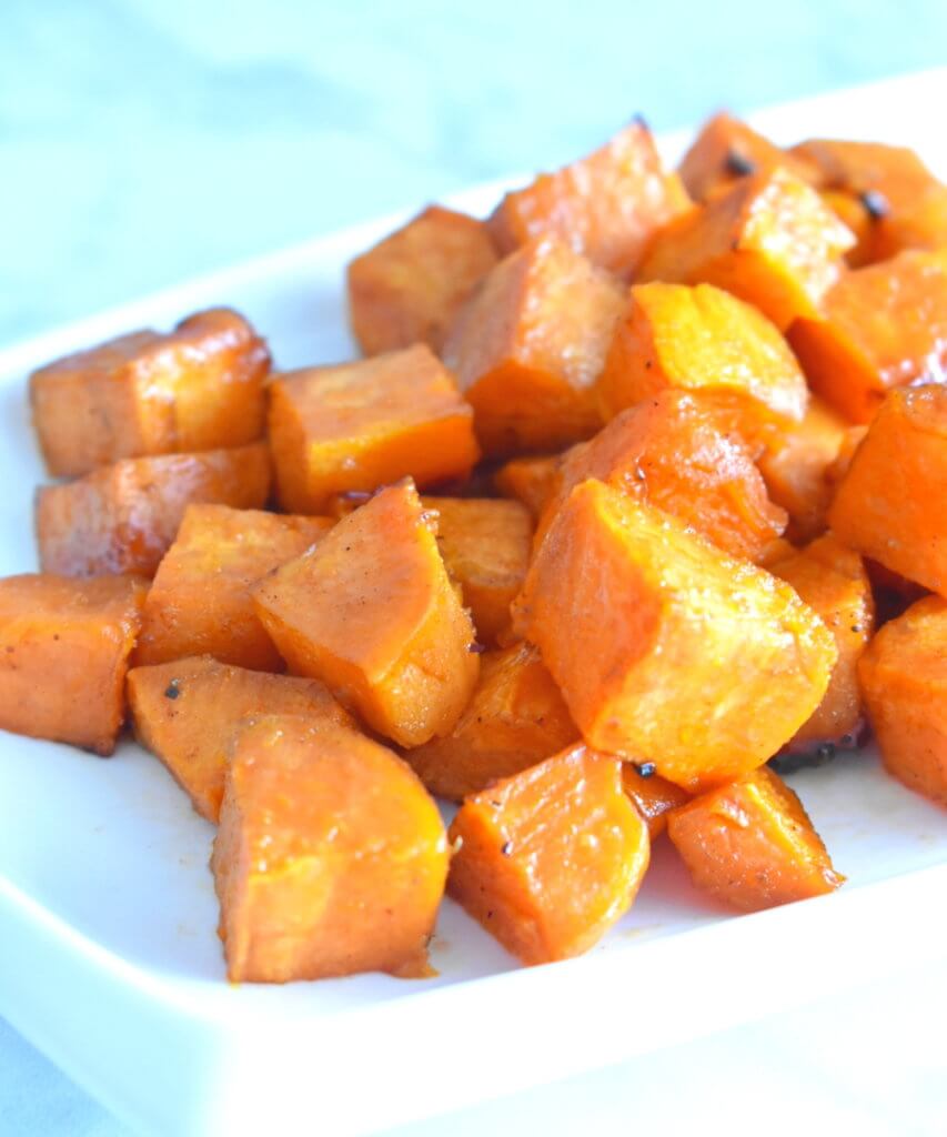 Closeup of a platter of Maple Roasted Sweet Potatoes.