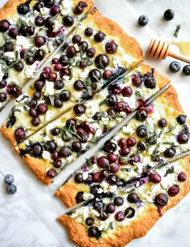 Blueberry Basil Flatbread freshly drizzled with honey.