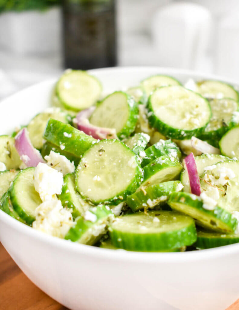 A bowl of Cucumber Feta Salad with red onions.