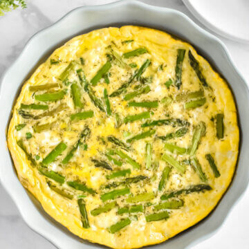 crustless asparagus quiche in a quiche pan