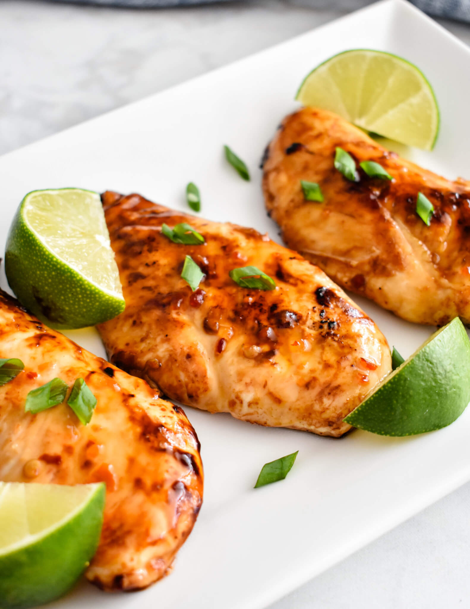 Closeup of Thai Sweet Chili Chicken breasts on a platter.