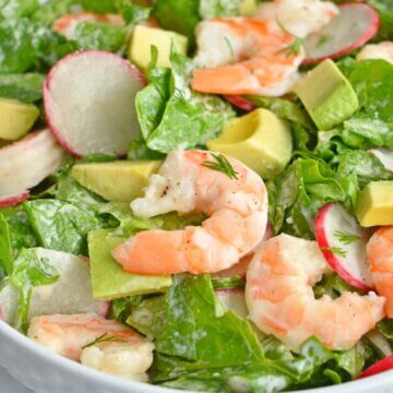 Closeup of a bowl of shrimp and avocado salad.