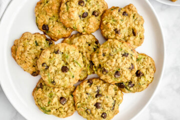 A platter of zucchini cookies with oatmeal and chocolate chips.