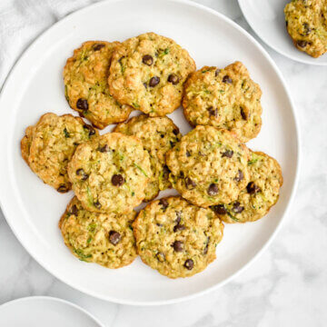 A platter of zucchini cookies with oatmeal and chocolate chips.