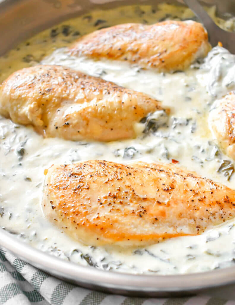 Close up of a pan of Creamy Spinach Chicken.