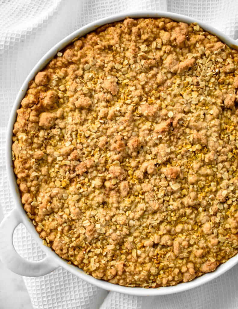 Top view of pumpkin crumble baked in a round baking pan.
