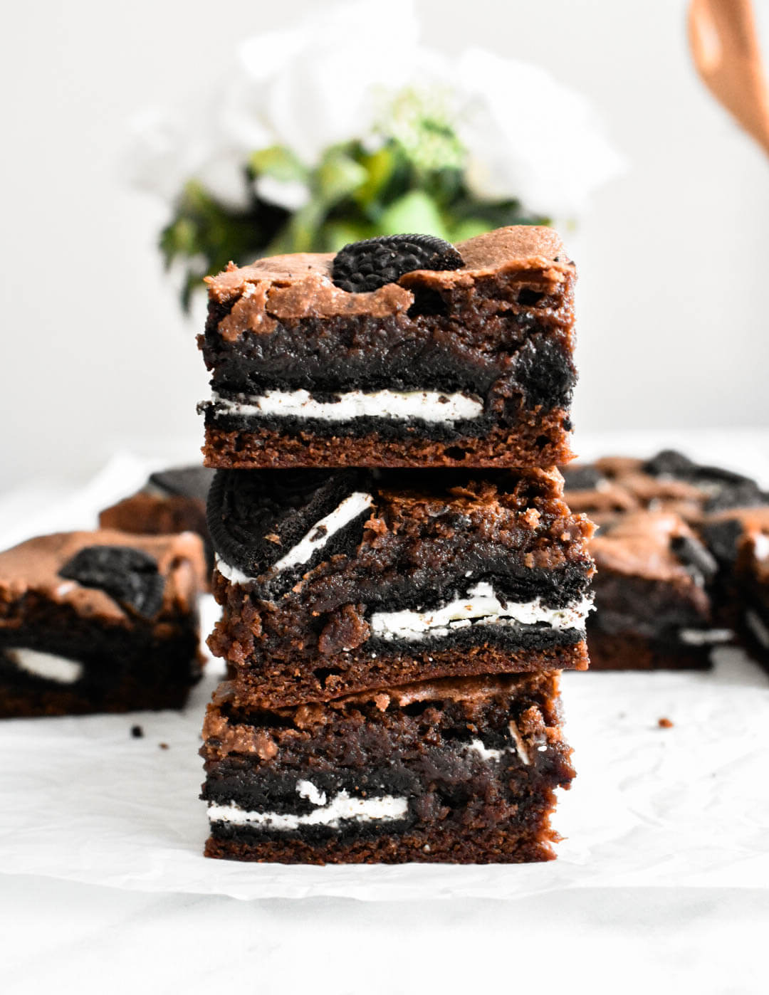 A stack of three oreo brownies.