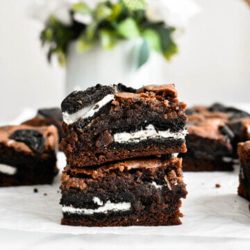 Two fudgy Oreo Brownies stacked on top of each other.