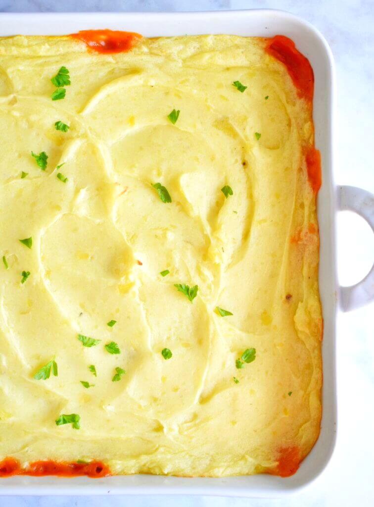 The creamy mashed potato layer of Turkey Shepherd's Pie sprinkled with parsley.