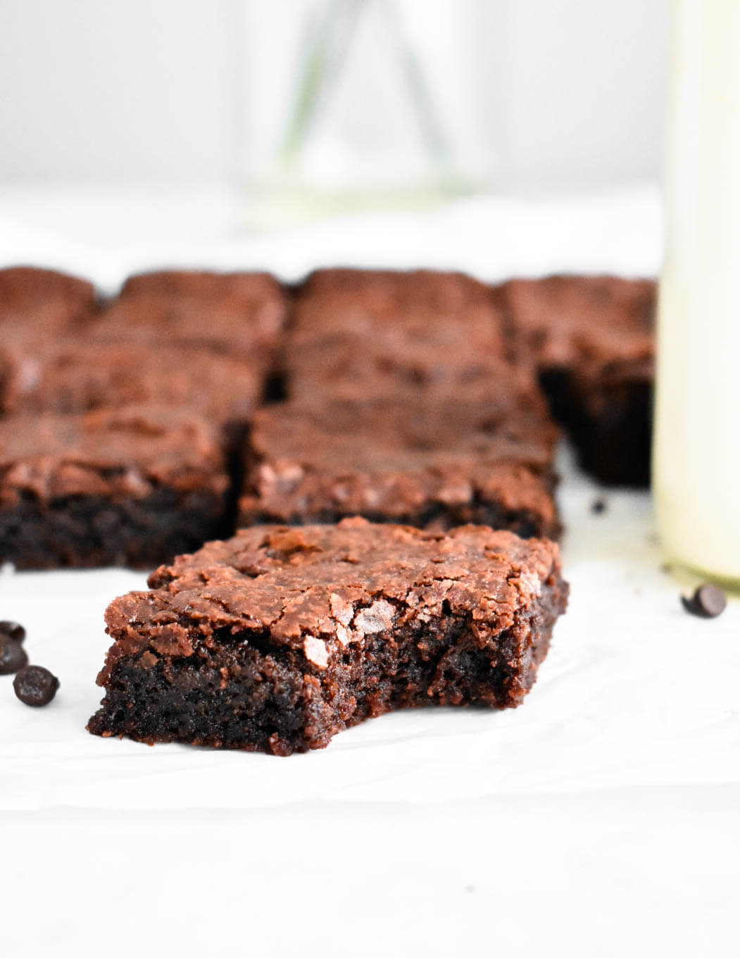 Closeup of a bitten brownie, showing the fudgy interior.