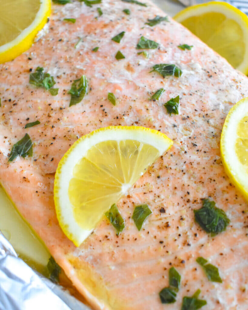 Baked Herb Butter Salmon topped with lemon slices