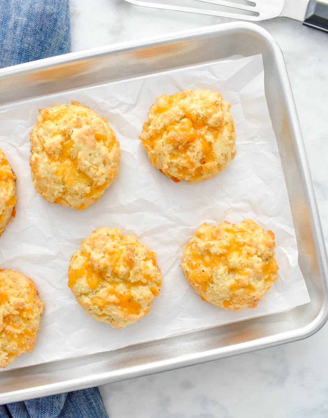 Keto Cheddar Biscuits on a baking pan