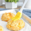 keto cheddar biscuits brushed with melted butter