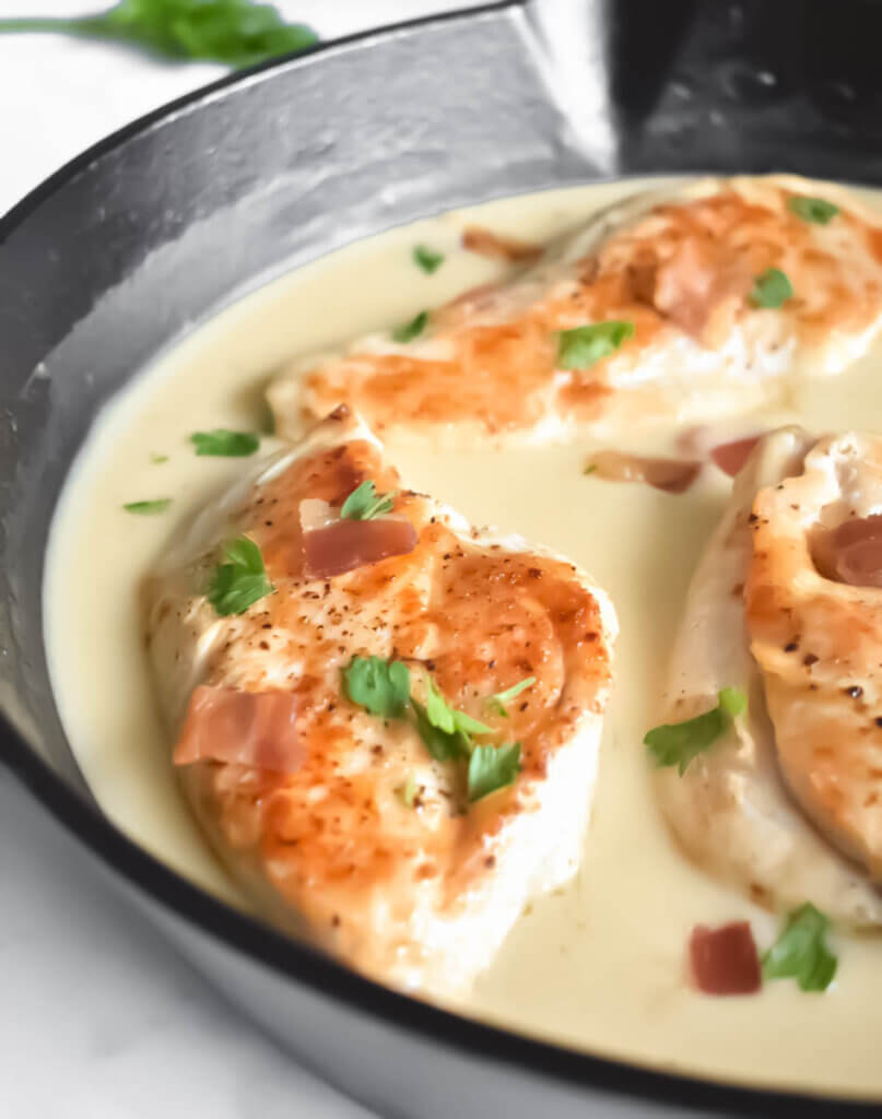 Creamy Honey Mustard Chicken with Bacon in a cast iron skillet.