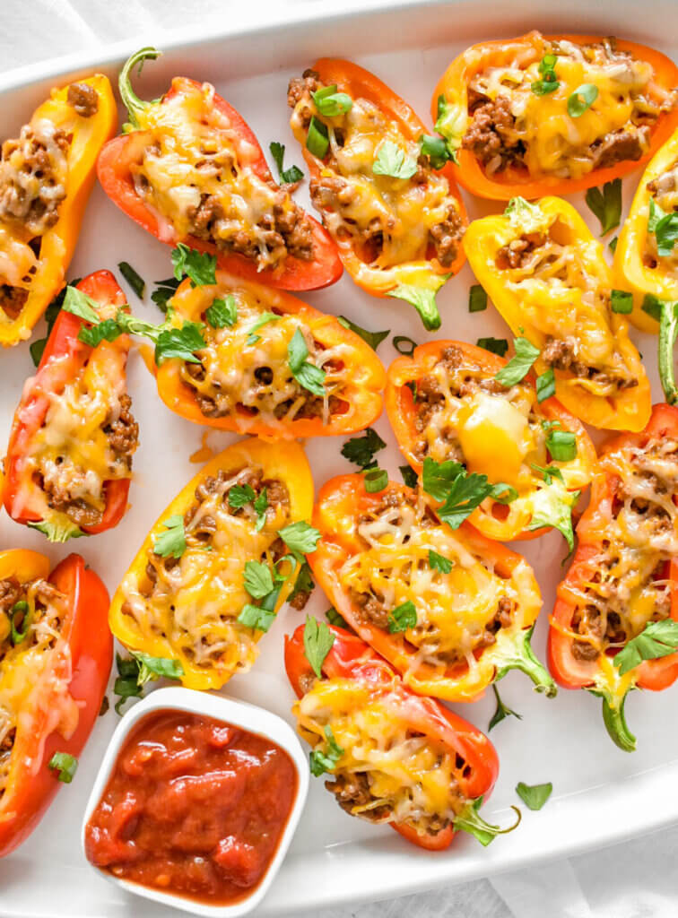 Tray of Taco Stuffed Mini Peppers topped with cheese