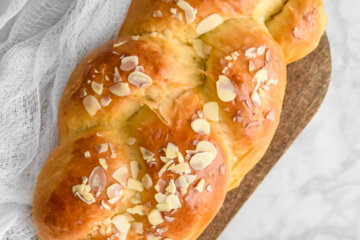 Tsoureki - Greek Easter Bread loaf topped with almond slivers
