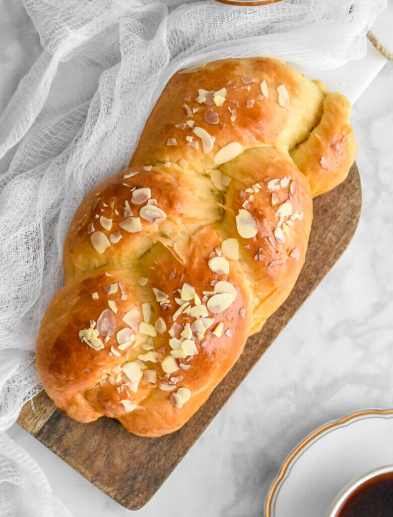 Tsoureki - Greek Easter Bread loaf topped with almond slivers