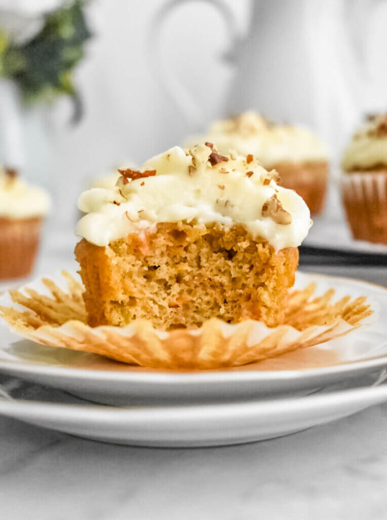 carrot cake cupcakes bite shot showing fluffy texture.