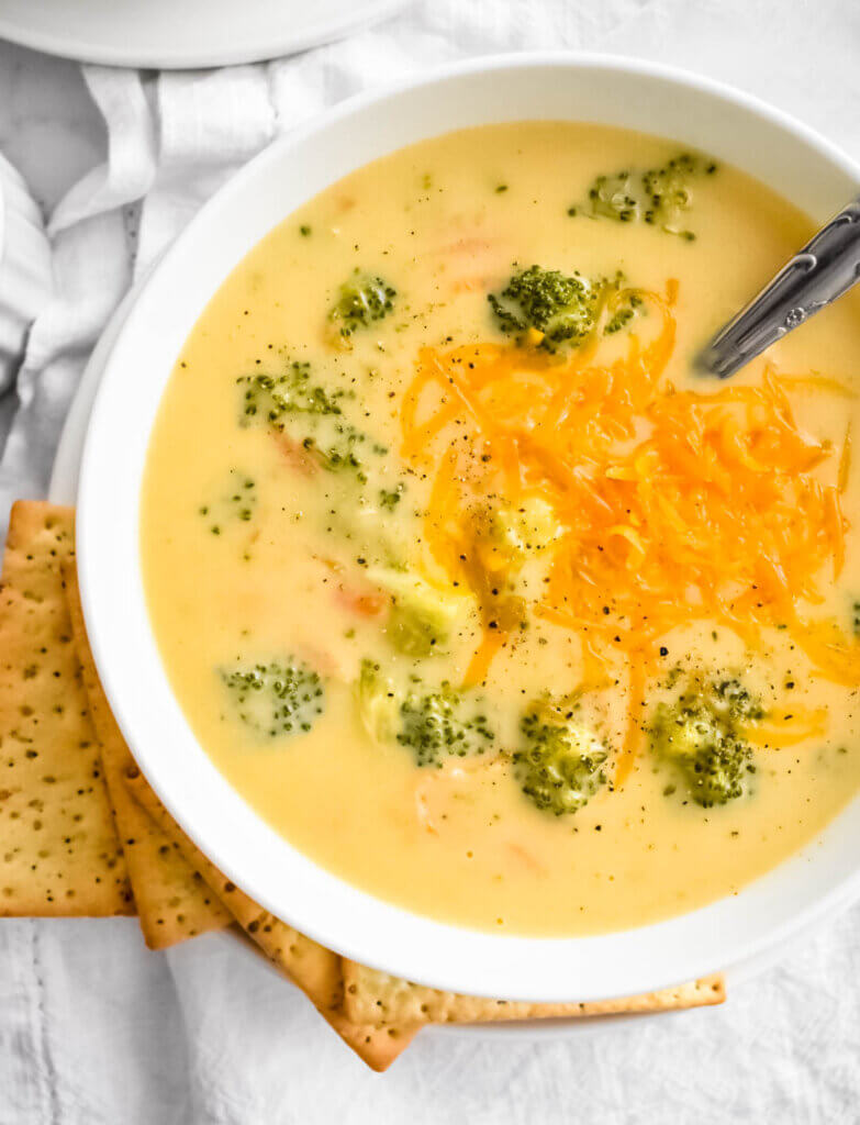 homemade broccoli cheddar soup recipe with extra shredded cheese on top