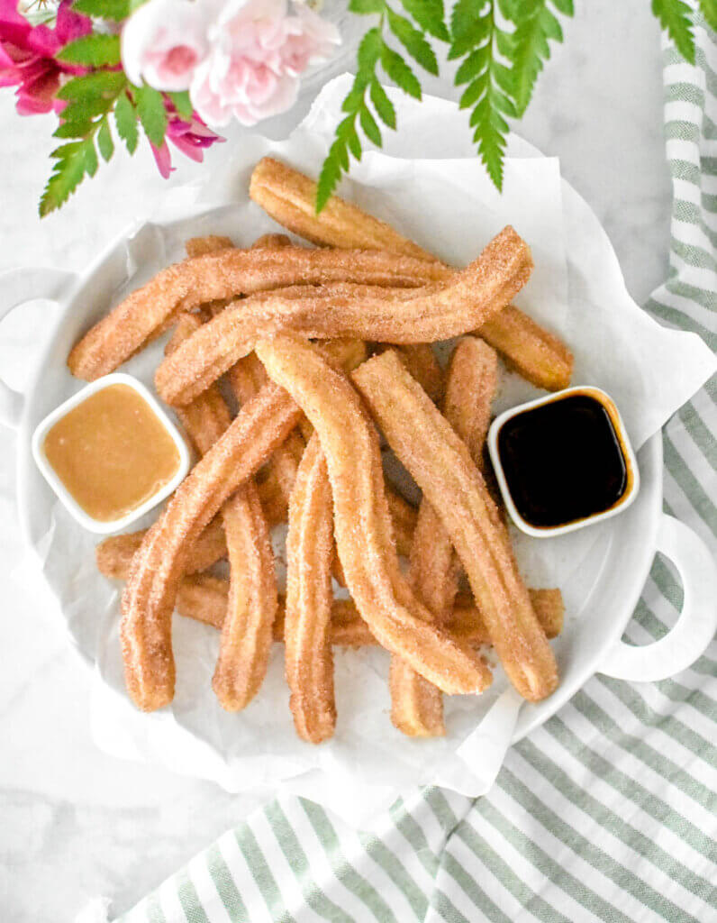 Churros with caramel and chocolate dipping sauce
