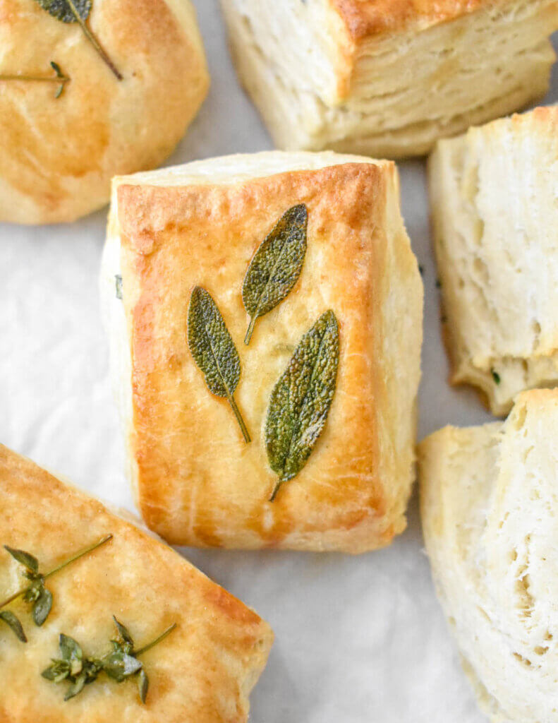 herb biscuit topped with sage leaves