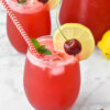 Cherry Lemonade topped with a lime slice and fresh cherry