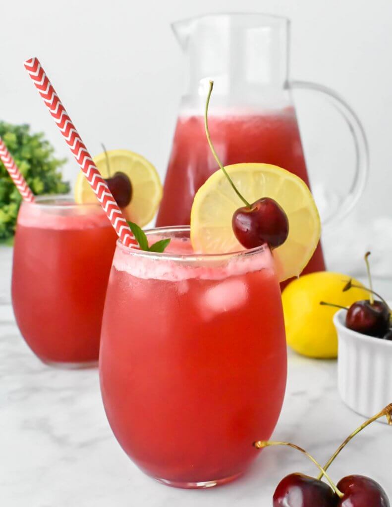 Cherry Lemonade in glasses and a pitcher