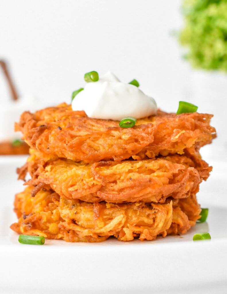 Stack of Sweet Potato Hash Browns sprinkled with fresh green onion