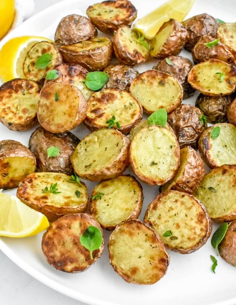 crispy air fryer potatoes sprinkled with fresh herbs