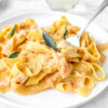 plate of Pumpkin Fettucine Alfredo topped with sage