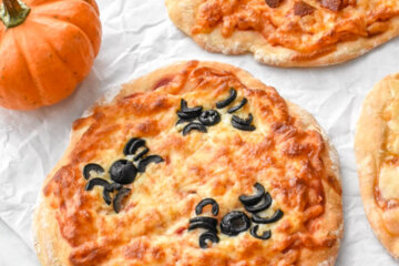 Halloween Pizzas with spider pizza design and jack o' lantern pizza design