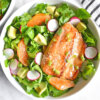 Asian Salmon Salad bowl with radishes, orange and avocado