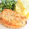 Baked Breaded Pork Chops with mashed potatoes and green beans