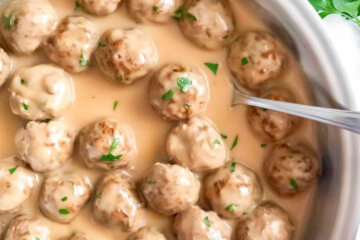 Pan of Baked Swedish Meatballs covered in creamy gravy